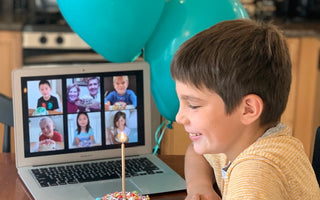 Virtual Party Idea - Personal-sized cake kit. Picture of boy on Zoom eating his cake with friends, virtually